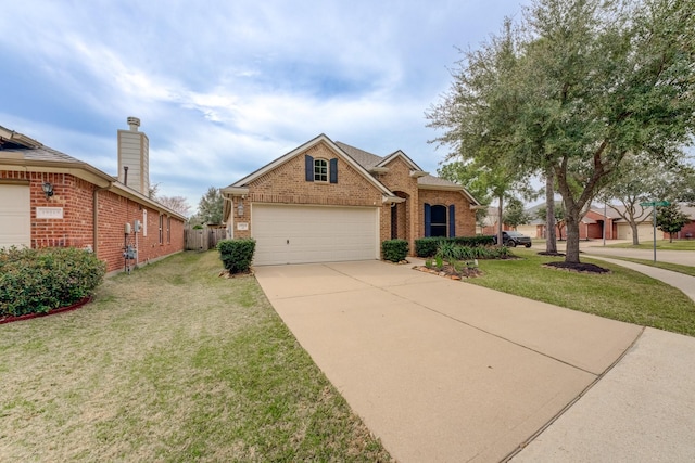 traditional-style house featuring driveway, brick siding, an attached garage, fence, and a front yard