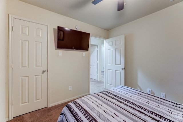 bedroom featuring ceiling fan, carpet, and baseboards