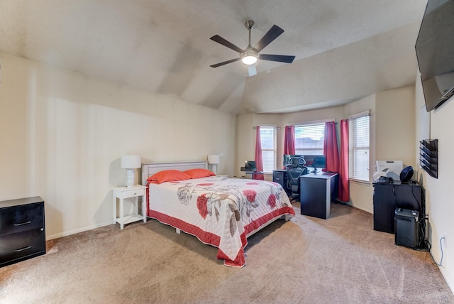 bedroom featuring carpet floors, ceiling fan, baseboards, and vaulted ceiling