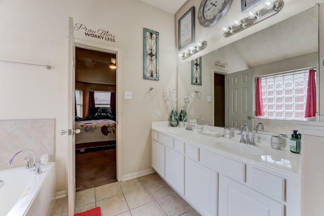 full bath with tile patterned flooring, a sink, a bath, and ensuite bathroom