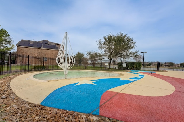 view of basketball court featuring fence