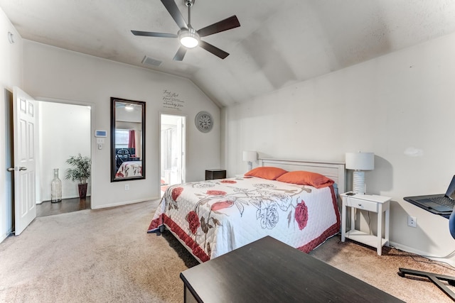 bedroom with carpet floors, ceiling fan, visible vents, and vaulted ceiling