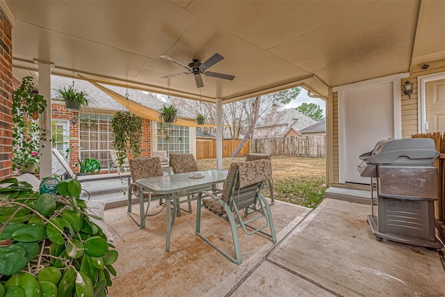 view of patio / terrace featuring outdoor dining area, a ceiling fan, and fence