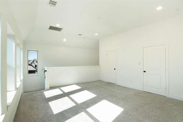 empty room with visible vents, recessed lighting, baseboards, and carpet floors