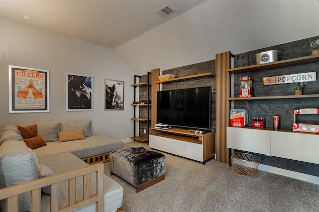 living area featuring vaulted ceiling, visible vents, and carpet floors