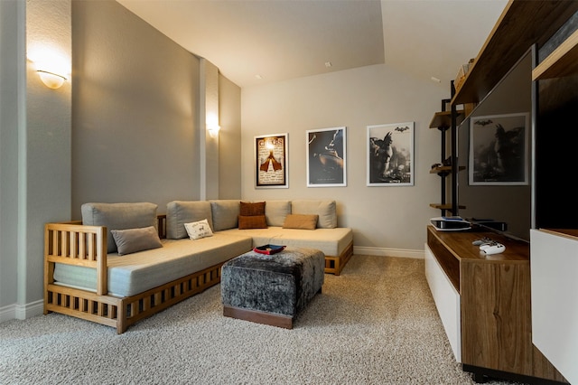 cinema room with baseboards, carpet, and vaulted ceiling