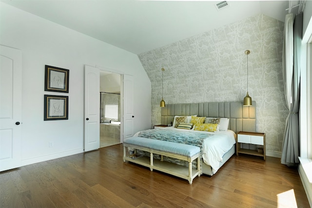 bedroom featuring visible vents, wallpapered walls, baseboards, and wood finished floors