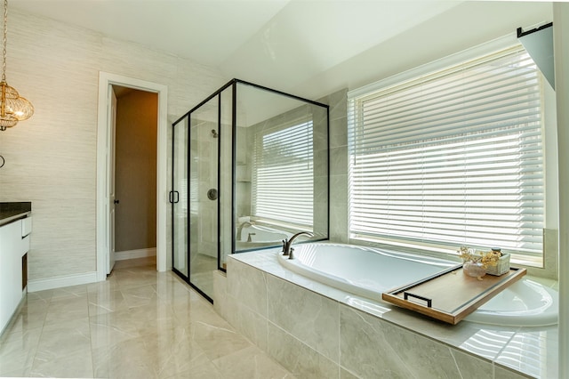 full bathroom featuring a shower stall, baseboards, a bath, marble finish floor, and vanity