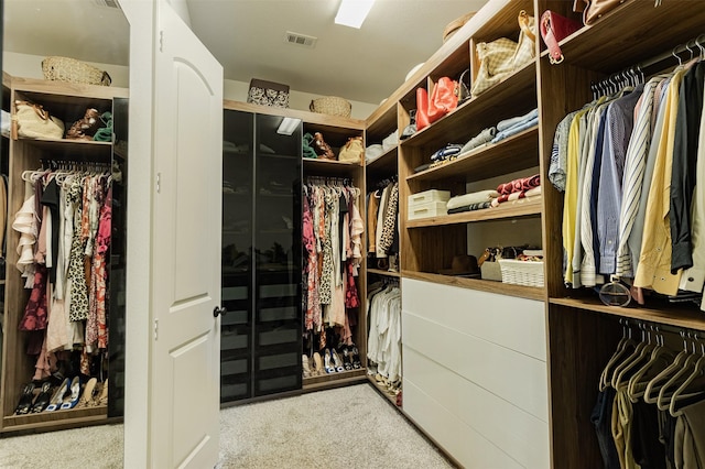 spacious closet featuring visible vents and carpet flooring