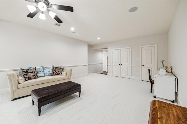 living room with baseboards, visible vents, light colored carpet, ceiling fan, and recessed lighting