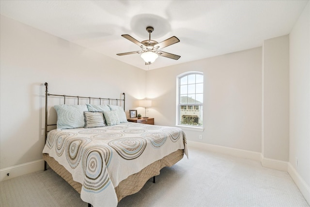 bedroom featuring ceiling fan, carpet floors, and baseboards