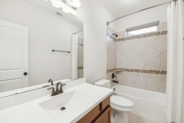 full bathroom with shower / tub combo, visible vents, toilet, tile patterned floors, and vanity