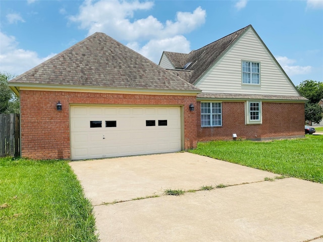 view of side of property featuring an attached garage, brick siding, concrete driveway, a lawn, and roof with shingles