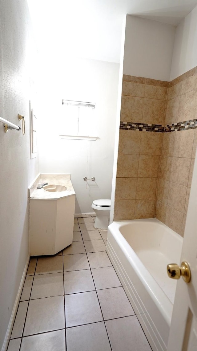 full bathroom with tile patterned flooring, baseboards, vanity, and toilet