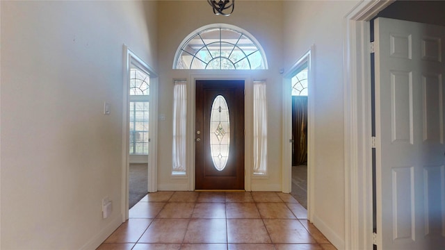 foyer entrance with light tile patterned flooring