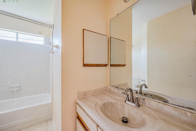 bathroom with tile patterned flooring, vanity, and bathtub / shower combination