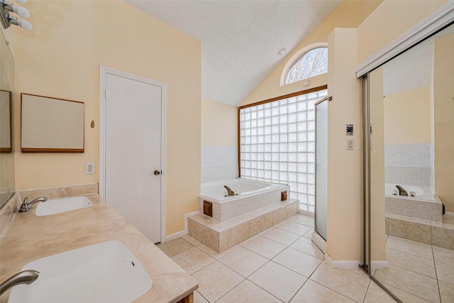 full bath featuring a sink, double vanity, and tile patterned floors