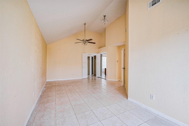 unfurnished room featuring visible vents, high vaulted ceiling, light tile patterned flooring, baseboards, and ceiling fan