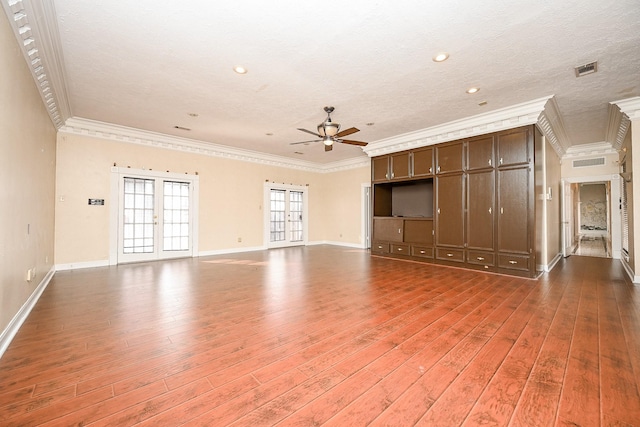 unfurnished living room featuring french doors, crown molding, light wood finished floors, a ceiling fan, and baseboards