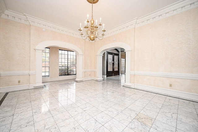 empty room with arched walkways, marble finish floor, baseboards, and wallpapered walls