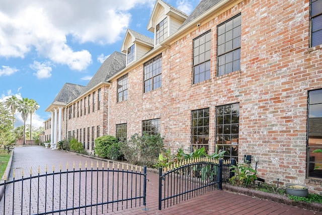 view of property with fence