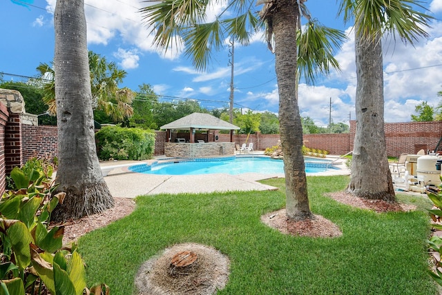 view of pool featuring fence private yard, a yard, a fenced in pool, and a gazebo