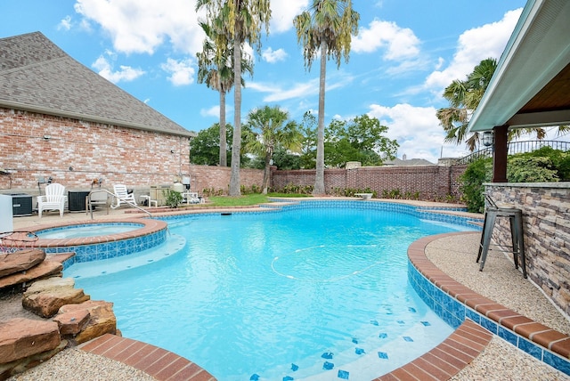 view of swimming pool featuring an in ground hot tub, central AC unit, a fenced backyard, and a fenced in pool