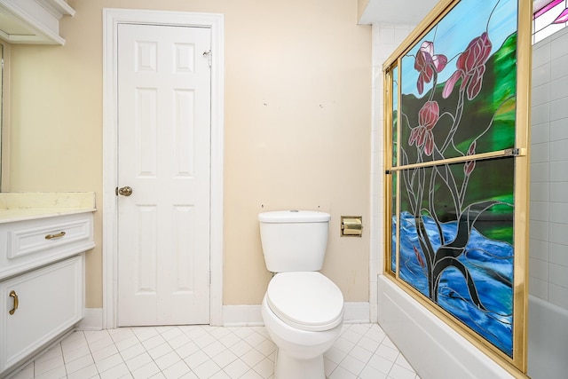 full bathroom featuring toilet, enclosed tub / shower combo, vanity, baseboards, and tile patterned floors