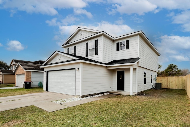 traditional home featuring central AC unit, fence, an attached garage, concrete driveway, and a front lawn