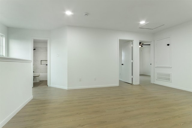 interior space with light wood-style flooring, recessed lighting, baseboards, and visible vents