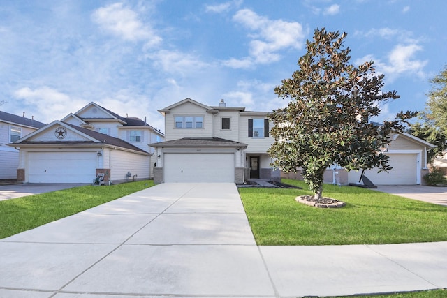 view of front of home with a garage, brick siding, driveway, and a front lawn