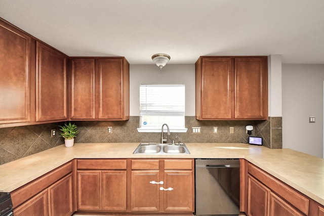 kitchen with light countertops, stainless steel dishwasher, backsplash, and a sink