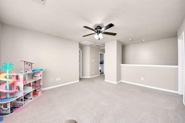 game room with carpet, ceiling fan, and baseboards