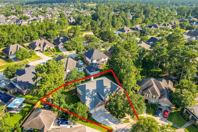 birds eye view of property with a residential view