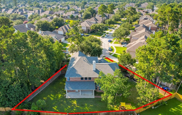 birds eye view of property with a residential view