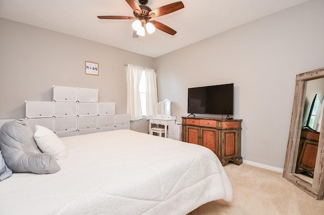 bedroom featuring ceiling fan, carpet floors, and baseboards