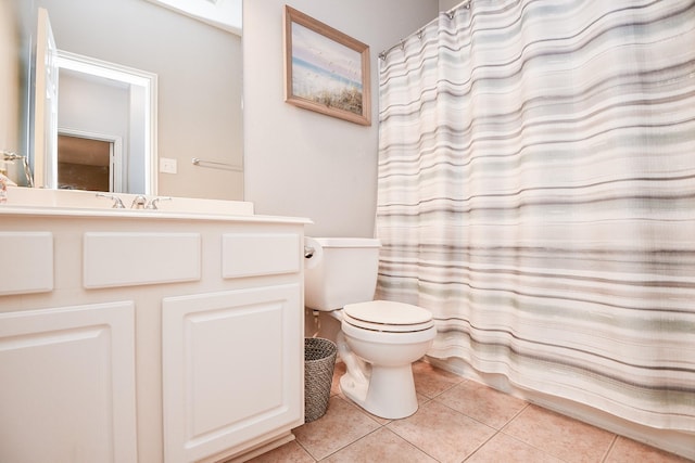 bathroom with vanity, tile patterned flooring, toilet, and a shower with curtain