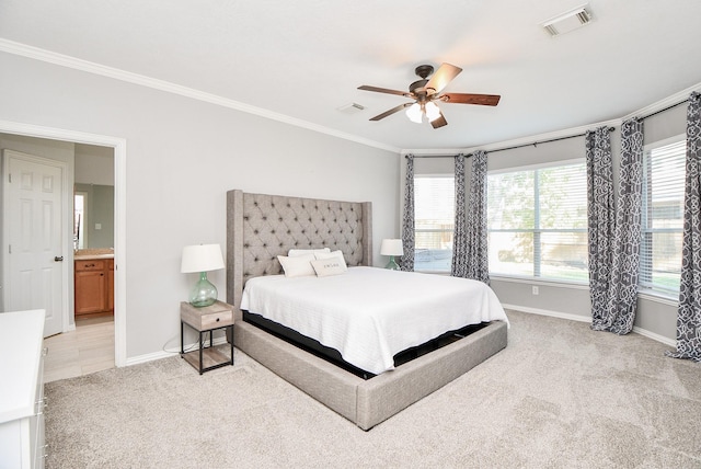 bedroom with baseboards, visible vents, a ceiling fan, light colored carpet, and crown molding