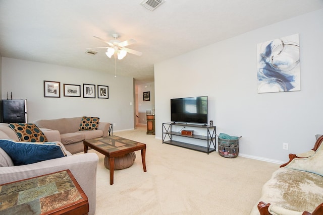 living room featuring carpet, visible vents, and baseboards