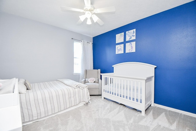 carpeted bedroom featuring ceiling fan and baseboards