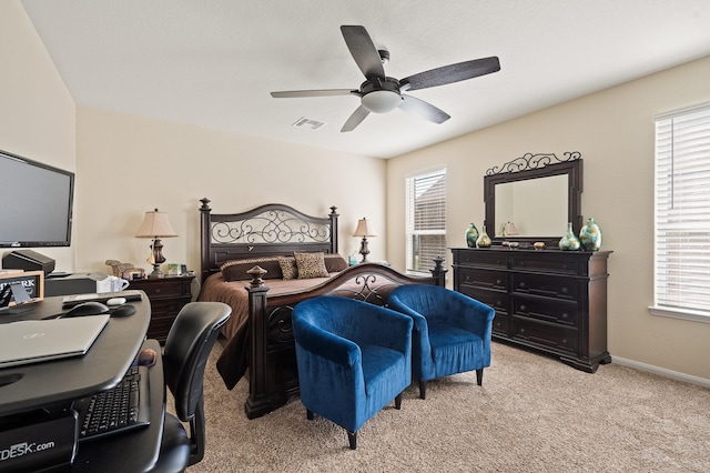 bedroom featuring carpet floors, ceiling fan, visible vents, and baseboards