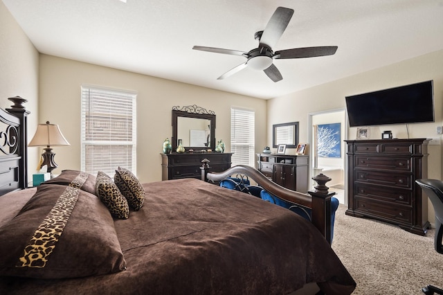 bedroom with a ceiling fan and carpet flooring