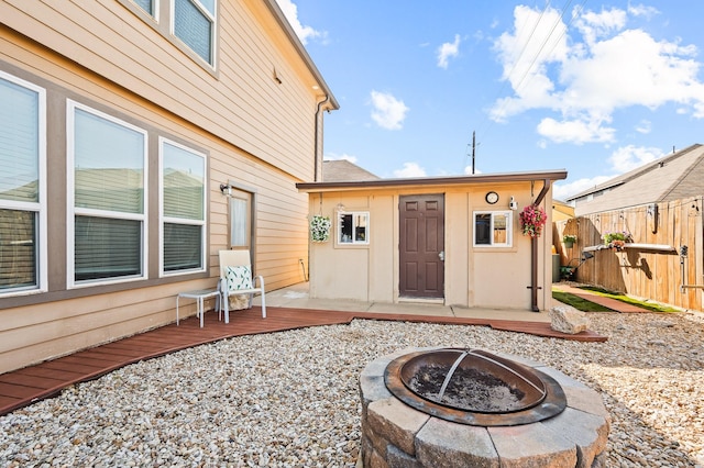 exterior space featuring fence and a wooden deck