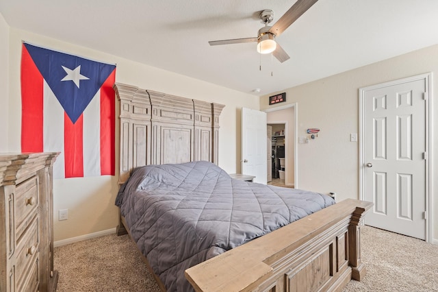 carpeted bedroom featuring a ceiling fan and baseboards