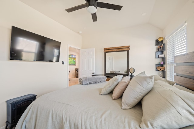 carpeted bedroom with lofted ceiling and ceiling fan