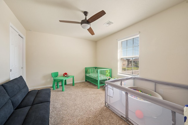 recreation room with carpet floors, baseboards, visible vents, and a ceiling fan