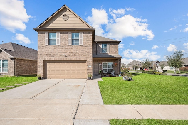 traditional home with a garage, concrete driveway, brick siding, and a front yard