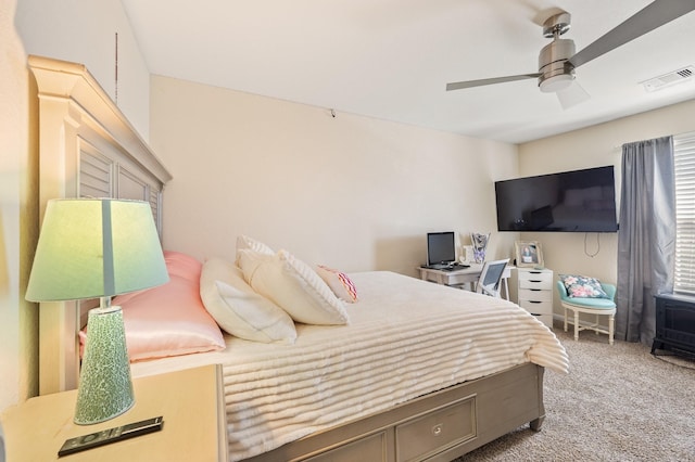 bedroom featuring carpet floors, visible vents, and ceiling fan