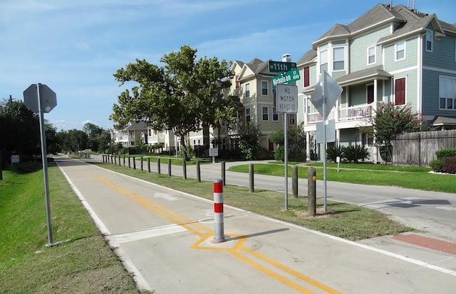 view of street with traffic signs and a residential view