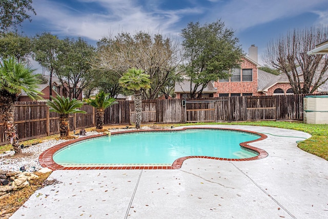 view of pool with a fenced in pool, a patio area, and a fenced backyard